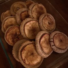 a pile of pies sitting on top of a wooden table