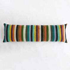 a multicolored striped pillow on a white background with space for the wording