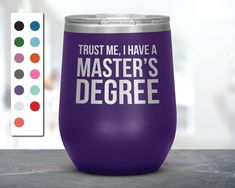 a purple wine tumbler with trust me i have a master's degree on it