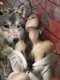 a woman with her eyes closed next to a wolf