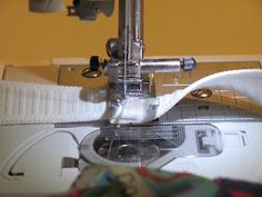 the sewing machine is being used to sew fabric on it's front end