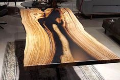 a coffee table made out of wood with an image of a river on it's surface