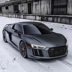 an audi sports car parked in the snow