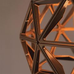 a close up view of an ornament made out of wood and metal strips