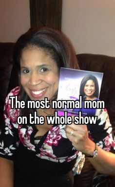 a woman holding up a book with the caption'the most normal mom on the whole show '