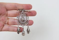 "Late 19th Century, 1880- 1890. Italian locket pendant in 900 silver. CONDITION: Very good antique condition as seen. Glass intact. Locket closes fine. MEASUREMENTS: with bail 3 3/8\" x 1 1/8\" (85 x 28mm). Weight: 12,3g. * * * All our items are packed in gift boxes, easy to check of content and re-pack. If you wish something special, please let us know. * * * LAYAWAYS: All items can be put on layaway, max 4 months. First payment should be no less than 1/4 of total price including non-refundable Antique Pendant Brooch With Intricate Design, Ornate Engraved Brooch, Victorian Locket Pendant Brooches, Victorian Brooches With Locket Pendant, Victorian Silver Coin Pendant Jewelry, Victorian Engraved Medallion Brooches, Antique Engraved Medallion Brooches, Silver Medallion Brooches As A Gift, Victorian Silver Engraved Brooch