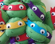 a bunch of stuffed toys that look like teenage mutant turtles