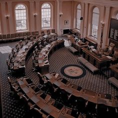 an aerial view of a large room filled with chairs and desks in the middle of it