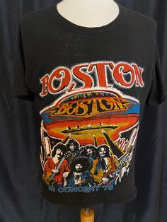 a black shirt with the band boston on it