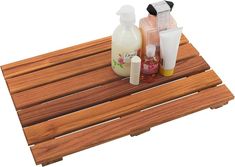 a wooden shelf with soap, lotion and other items