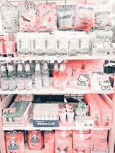 a store shelf filled with lots of pink and white items