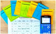 a calculator, notebooks and pen sitting on top of a table