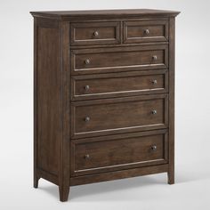 a brown chest of drawers with four drawers and two doors on the top one side