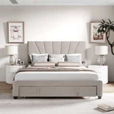 a bedroom with a bed, nightstands and two lamps on either side of the bed