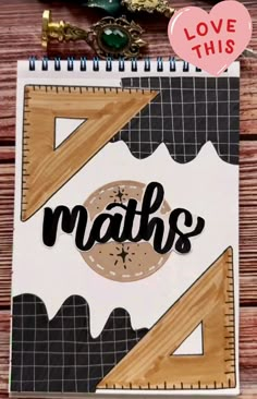 a notebook with the word maths written on it