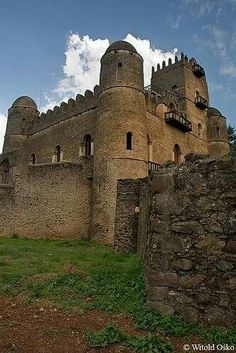 an old castle like structure with many windows and balconies