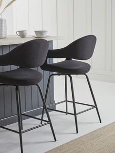 A natural accompaniment to our Bouclé Dining Chairs, these matching Counter Stools bring the same chic combination of neutral tones and effortless comfort to your setting. With seats fully upholstered in a versatile grey fabric, the stools are sold as a pair and offer comfortable curves, cocooning arms and contrasting black metal legs.  Also available in white. Full Length Mirror In Bathroom, Scandinavian Bar Stool, Loft Type, Corner Sofa Design, Kitchen Stool, Black Bar Stools