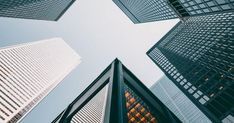 looking up at tall buildings in the city