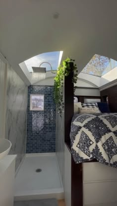 a bathroom with a shower, toilet and sink in it's centerpieces