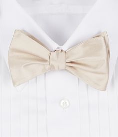 From Cremieux&#x2C; this bow tie features:         stylish handmade design silk Made in the USA from European silk. Gold Satin Bow Tie For Black-tie Events, Dapper Gold Bow Tie For Formal Occasions, Gold Dapper Bow Tie For Formal Occasions, Classic Gold Bow With Bow Tie Back, Formal Gold Suit And Tie Accessories With Decorative Bow, Formal Silk Decorative Bow, Elegant Pre-tied Satin Bow, Gold Elegant Bow With Tie Back, Formal Silk Satin Bow