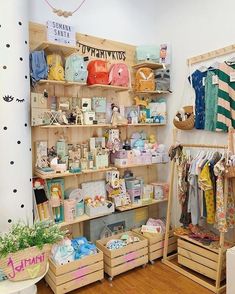 the inside of a store with lots of items on shelves and wooden crates in front of it