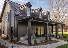 a large house with lots of windows on the front and side of it's roof