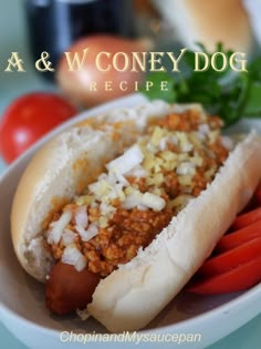 a close up of a hot dog on a plate with tomatoes