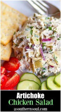 artichoke chicken salad with cucumbers, tomatoes and crackers on the side