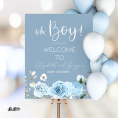 a baby shower sign with blue and white flowers on it, next to some balloons