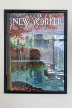 the new yorker magazine cover framed in a black frame with an image of a boat