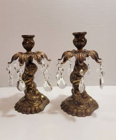 two antique style candlesticks with crystal drops