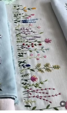 two different types of embroidered fabric with flowers on them