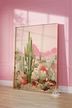 a pink room with a cactus painting on the wall and wooden floor in front of it