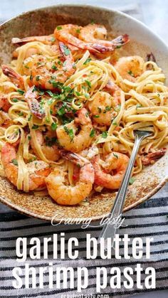 garlic butter shrimp pasta in a bowl with a fork