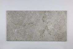 Do you want to get rid off your old porcelain tile flooring and looking for an affordable beauty of natural kitchen wall tiles or bathroom wall tiles? Tundra Gray Marble is what you just need. 12" X 24" Tile (Micro-Beveled) - Honed Wall and Floor Tile is a light grey stone comes from Turkish mountains. Each batch has its own color variation and that what it makes the subway tile bathroom is totally and uniquely yours. To get your tile installation cost less, you have to inform yourself with our Fireplace Backsplash, Grey Marble Tile, Gray Floor, Tile Crafts, Limestone Tile, Shower Walls, Gray Marble, Zellige Tile, Travertine Tile