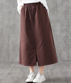 Casual Cotton loose fitting Women's Skirts Casual Brown Maxi Skirt For Fall, Relaxed Fit Brown Cotton Skirt, Non-stretch Long Brown Skirt, Non-stretch Brown Long Skirt, Brown Flowy Maxi Skirt With Pockets, Brown Maxi Skirt With Pockets For Fall, Relaxed Fit Brown Skirt, Brown Solid Color Long Skirt, Casual Brown Solid Color Skirt