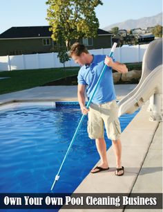 a man standing in front of a swimming pool holding a pole and wearing flip flops