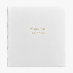 a wedding journal with gold lettering on the front and back cover, in white paper