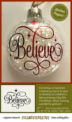 a glass ornament with the word believe on it and a christmas tree decoration