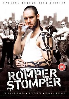 the movie romper stomper is shown in blue and white with an image of a man holding a snake