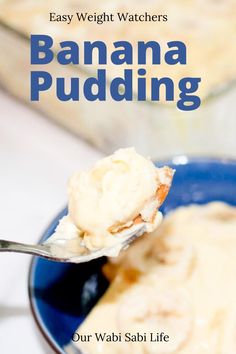 banana pudding in a blue bowl with a spoon