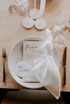 a table set with place settings and napkins