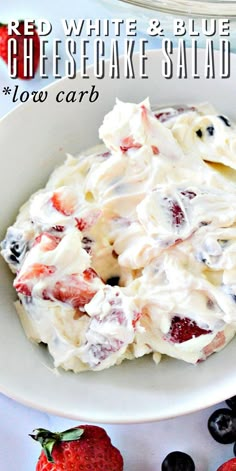 red, white and blue cheesecake salad in a bowl with strawberries on the side