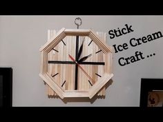 a clock made out of wood sitting on top of a wall