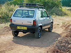 an off road vehicle is parked in the dirt