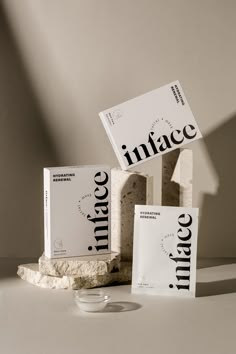 three packages of infacee are stacked on top of each other next to a small bowl