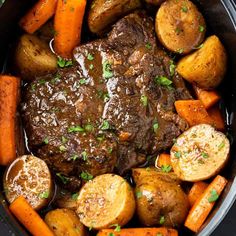 a pot roast with carrots, potatoes and parsley