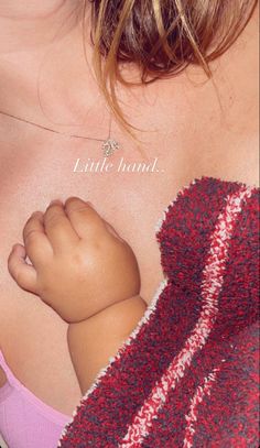 a close up of a baby's breast with the word little hand on it