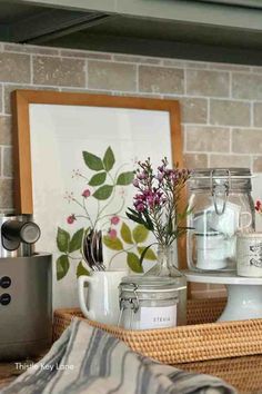 the kitchen counter is organized and ready to be used as a coffee bar or serving tray