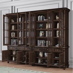 a large bookcase with many books on top of it in the middle of a room